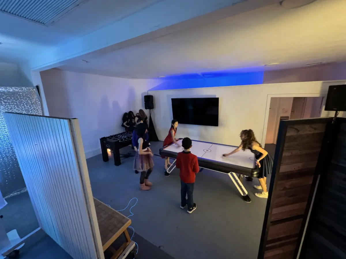 Air hockey and kids activities at a Bar Mitzvah event space in Culver City.