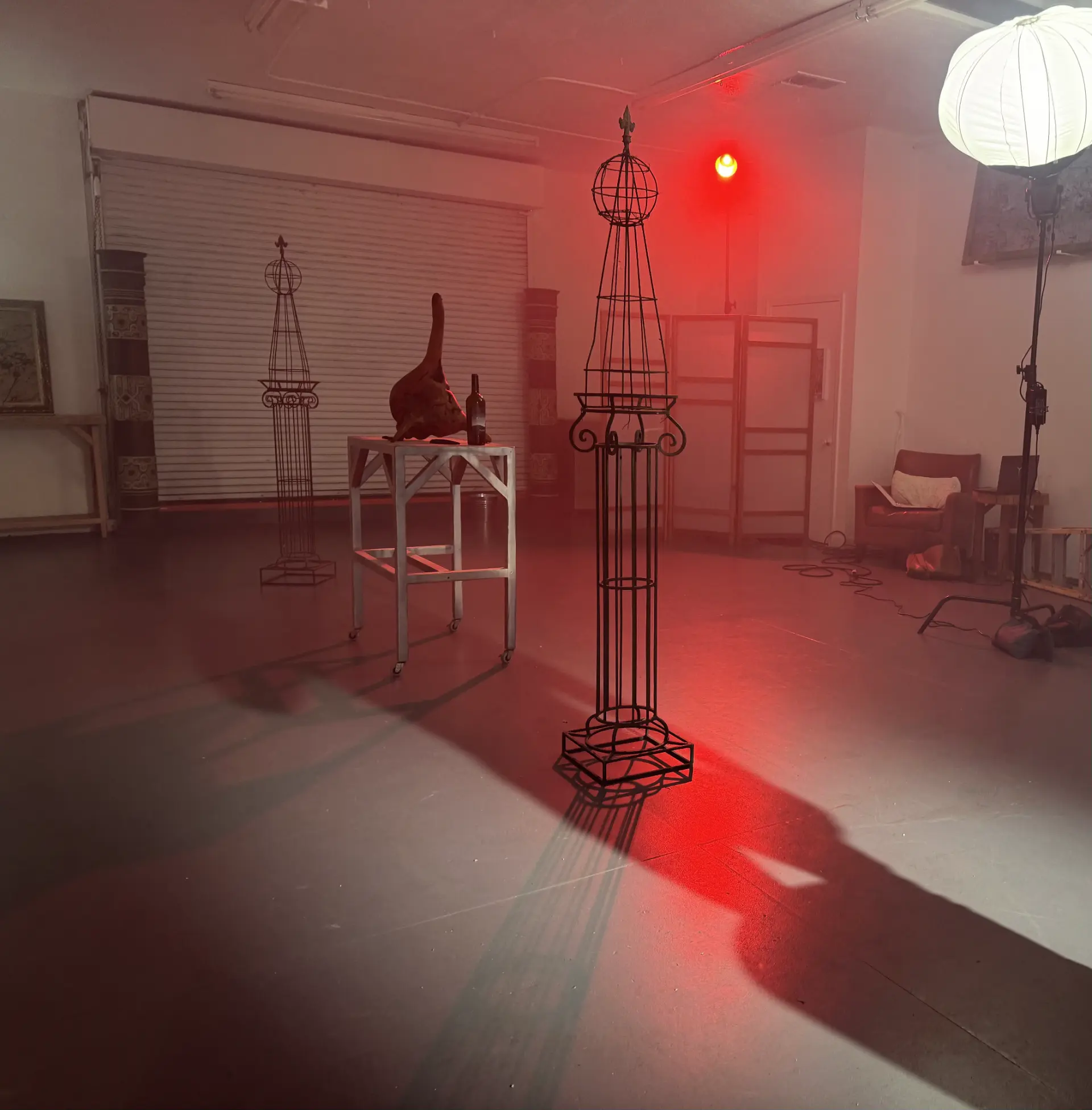 Dramatic red lighting illuminates an industrial event space Los Angeles premium venue for creative productions.