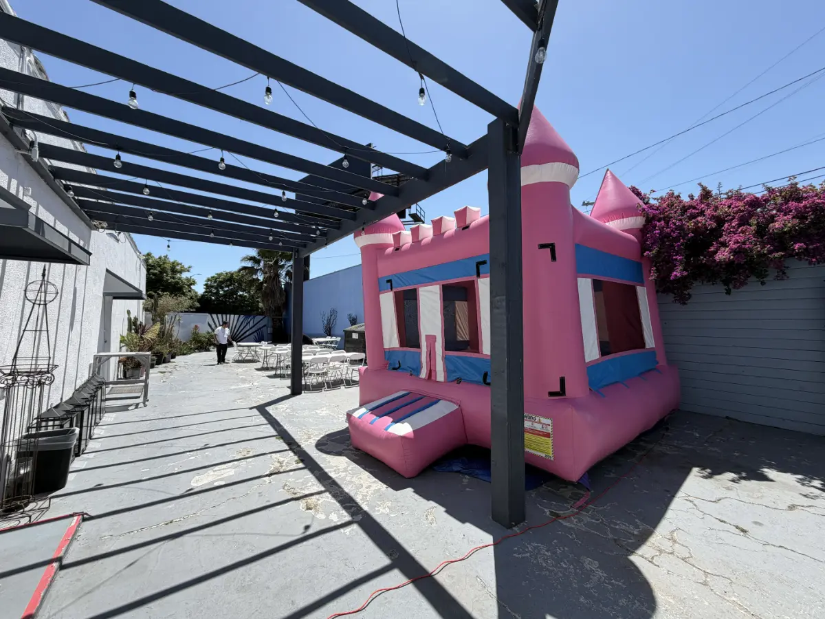 Pink bounce house setup at kids birthday party venue in West Adams Los Angeles