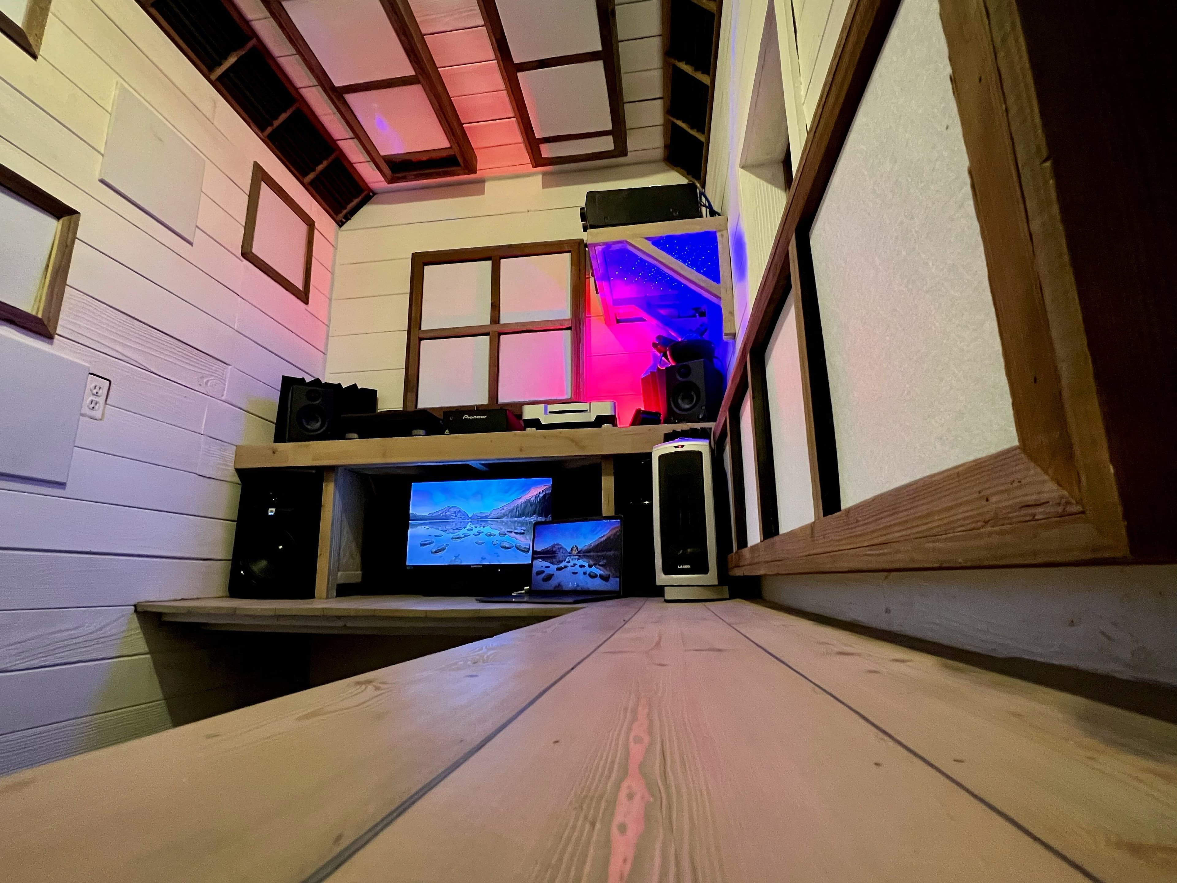 Podcast recording studio mixing desk with professional monitors and Pioneer equipment at Art and Space LA in Los Angeles.