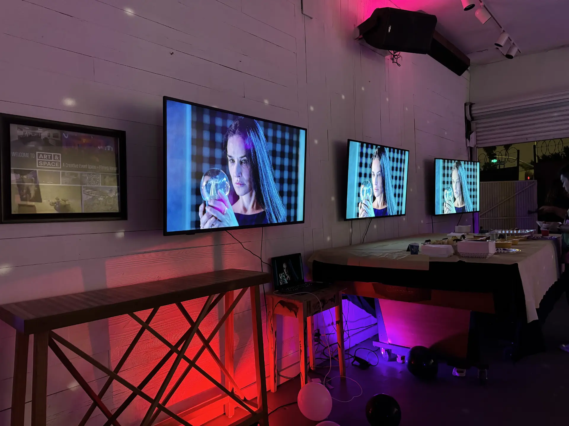 Modern interior view of a premium kids birthday party venue in Mar Vista featuring digital art displays for milestone events.