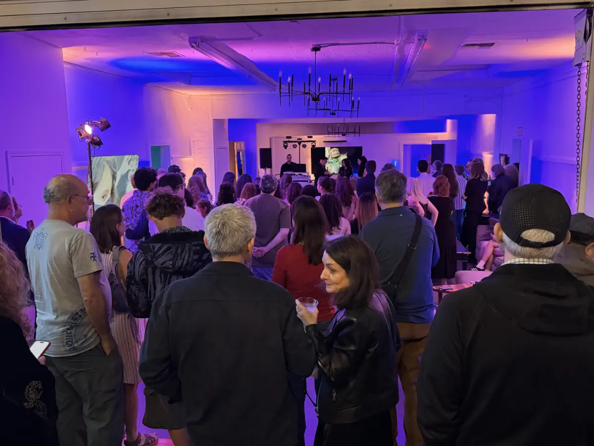 Guests dancing in a vibrant gallery at a premium Bat Mitzvah in Pico-Robertson with professional DJ lighting.