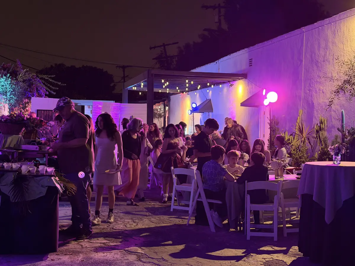 Evening string lights glow over an outdoor courtyard party for a premium Bat Mitzvah in Los Angeles.