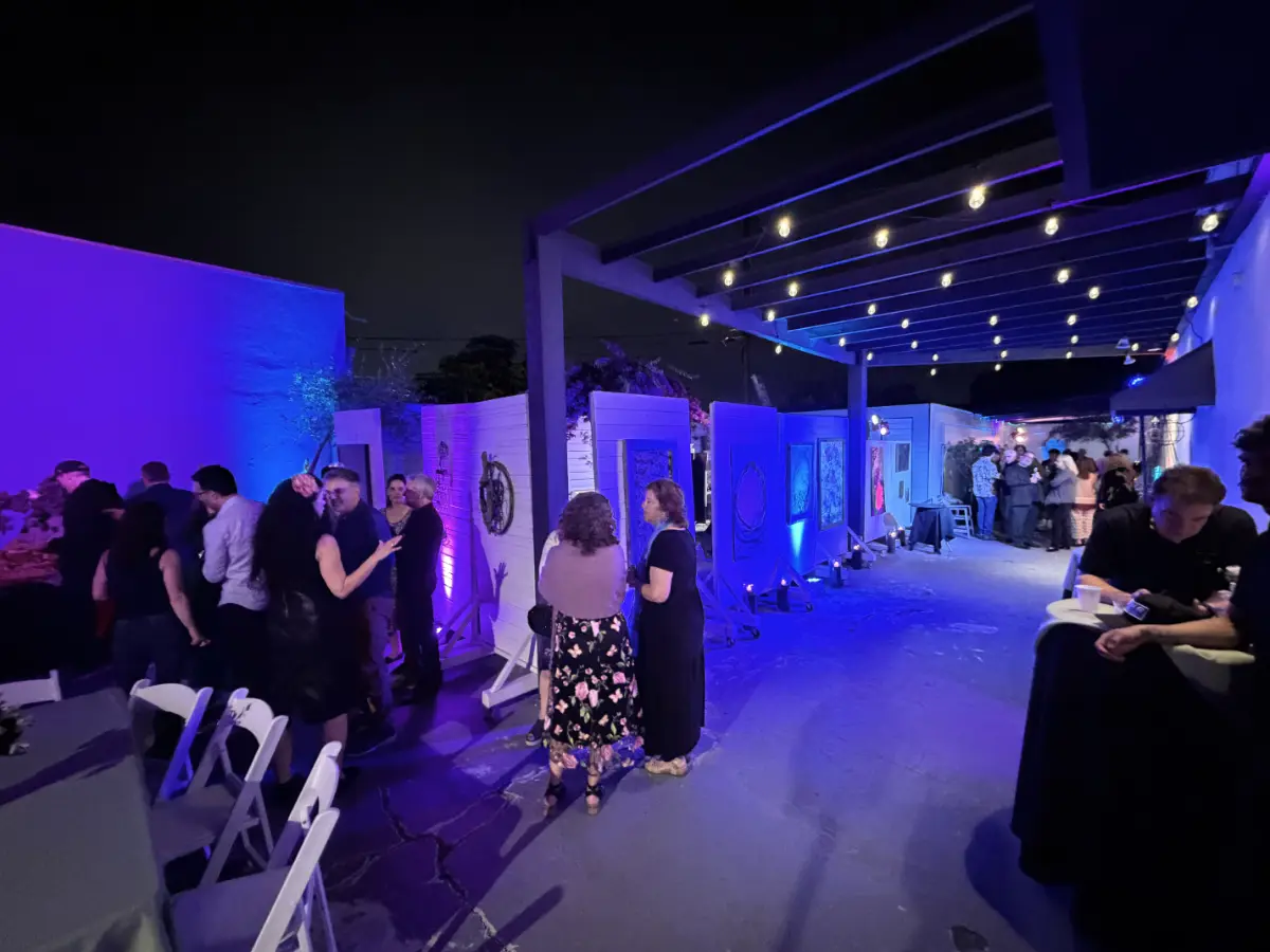 Guests socializing in a lit courtyard at a premium Bat Mitzvah in Culver City with contemporary art displays.
