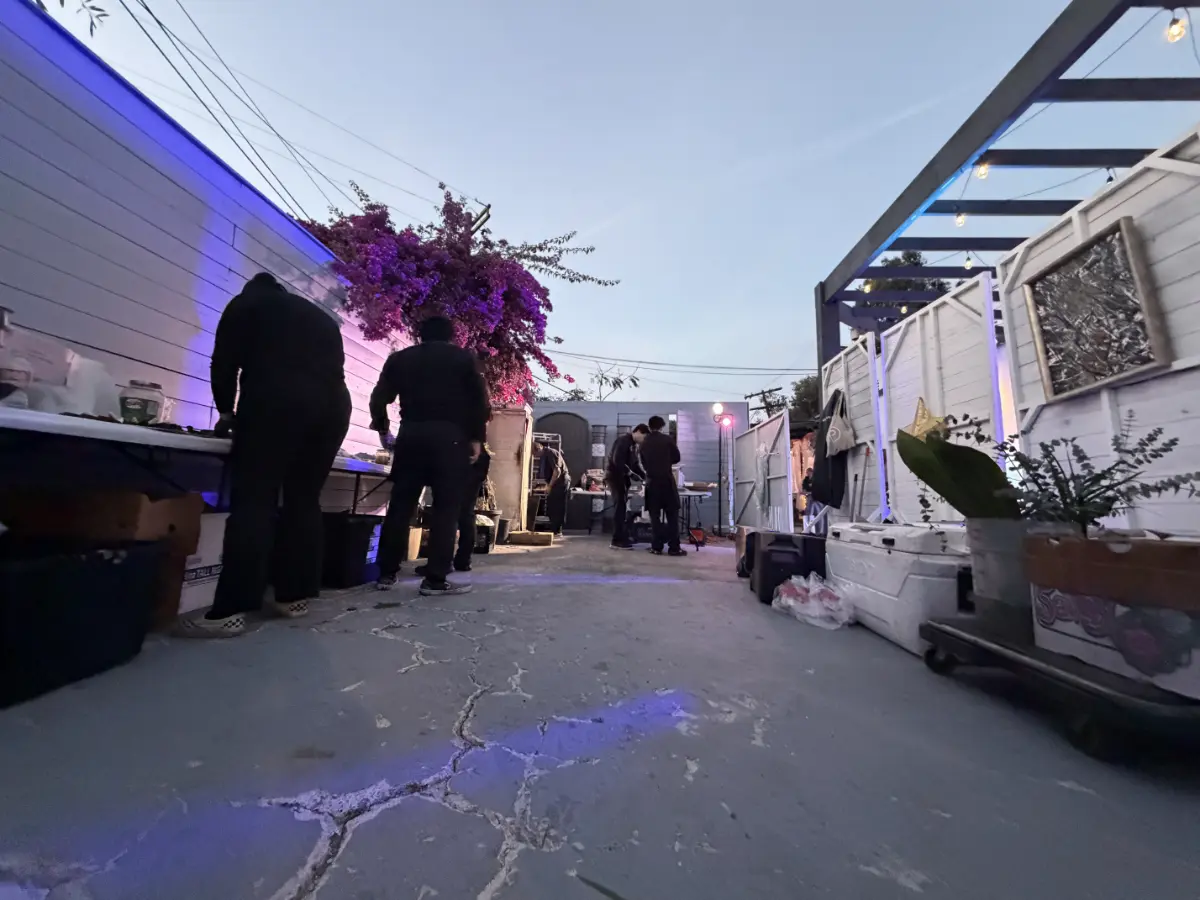 Professional outdoor patio setup for a BatMitzvah venue in West Hollywood showcasing premium purple lighting and wood paneling for an urban gathering.