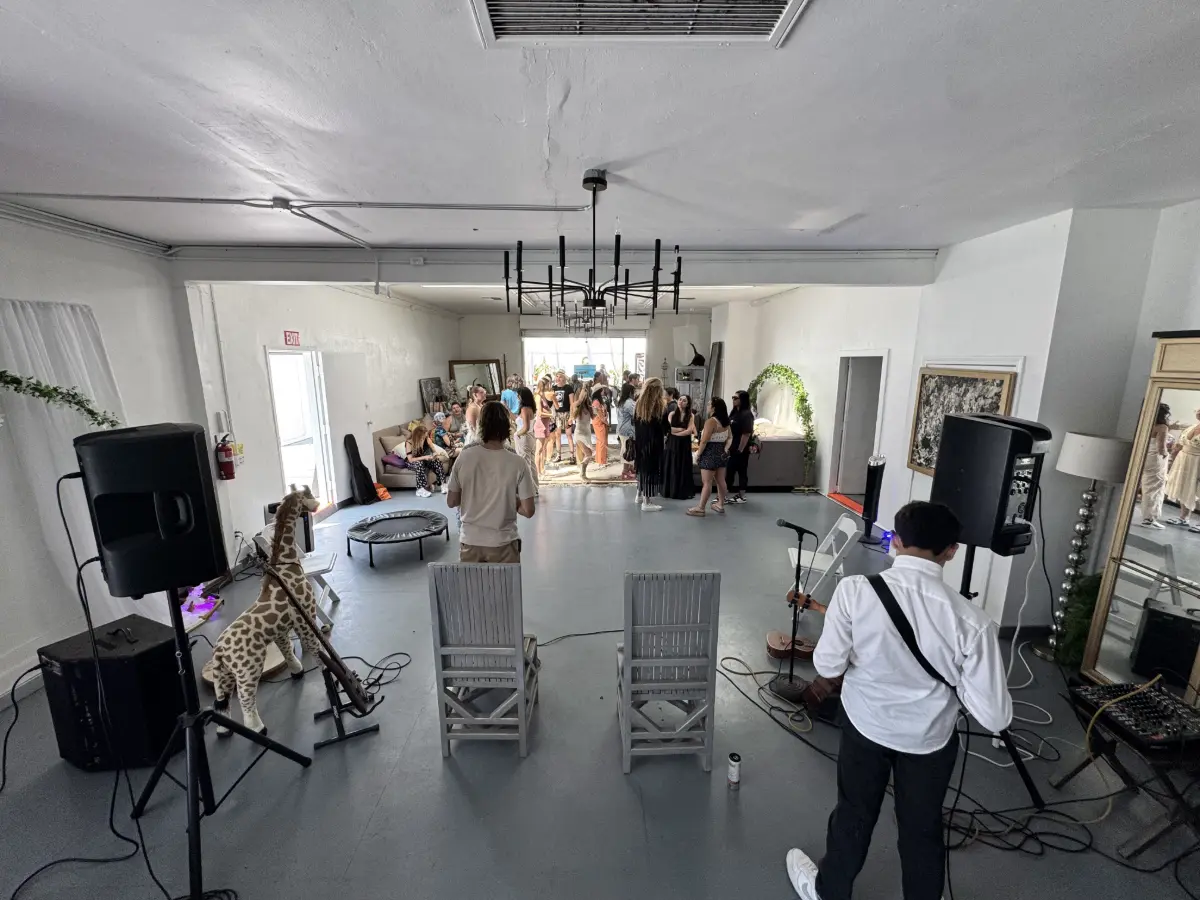 Open event room with high ceilings and speakers set up for a sound event at Art and Space LA in Mid-City Los Angeles