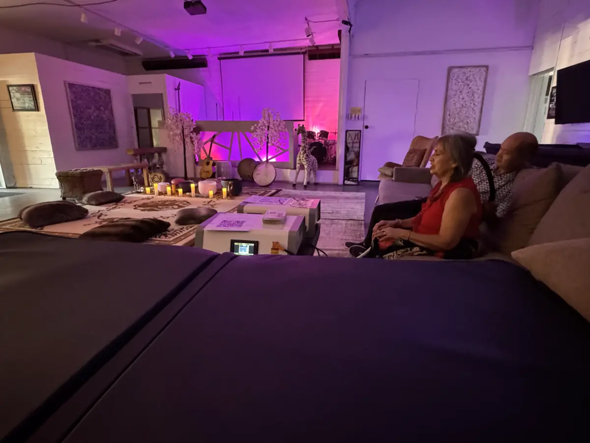 Sound healing practitioner with instruments and meditation cushions at Art and Space LA in Mid-City Los Angeles
